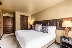The main suite bedroom with a king size bed.