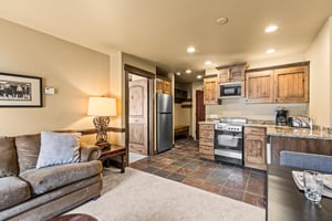 Unwind in your openconcept retreat where rustic wood cabinets and granite counters create a cozy mountain feel.