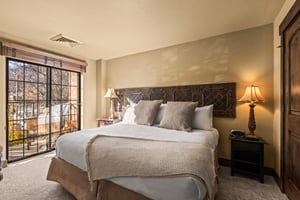 Wake up to gorgeous autumn views in your serene bedroom sanctuary, where crisp linens meet warm lamplight.