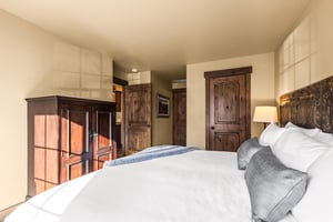 The main suite bedroom with a king size bed.