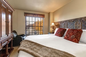 Wake up to breathtaking mountain views from your cozy bedroom.