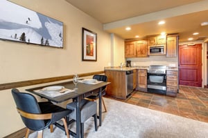 Your fully equipped kitchen with warm wood cabinets and granite counters.