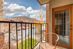 Step onto your private balcony and breathe in the crisp mountain air as you enjoy panoramic views of rolling hills and autumn colors from your cozy chair.