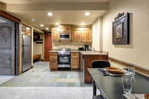 Your fully equipped kitchen with warm wood cabinets and granite counters.