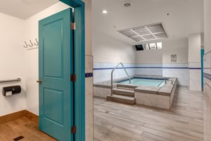 Unwind in your private spa sanctuary featuring a soothing hot tub with therapeutic jets.