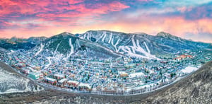 Aerial view of Park City Mountain Resort and Park City at sunset.
