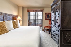 Sink into crisp white linens and plush pillows in your elegantly appointed bedroom.
