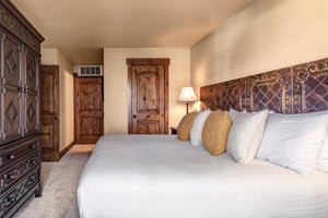 Sink into crisp white linens and plush pillows in your elegantly appointed bedroom with en suite bathroom.