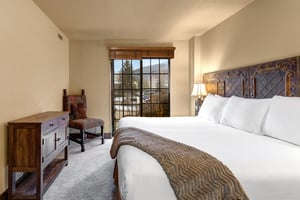 Unwind in your beautifully appointed bedroom with rustic charm, featuring crisp linens.