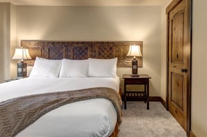Unwind in your beautifully appointed bedroom with rustic charm, featuring crisp linens.