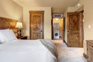 The main bedroom with a king size bed and en suite bathroom.