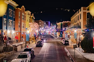 Historic Main Street with charming lights and ambiance at night.