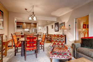 The open concept living, dining, and kitchen areas.