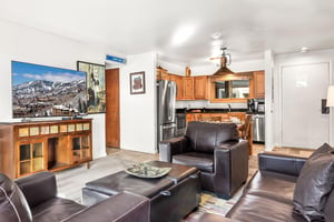 Relax in your spacious living area with comfortable leather seating, flatscreen TV, and fully equipped kitchen.