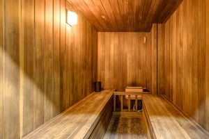Step into your private wooden sauna, where warm cedar walls create the perfect atmosphere for relaxation and rejuvenation.