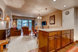 The kitchen with a breakfast bar with seating for 4.