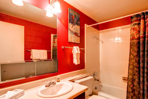 A full bathroom with a bathtub and shower combination.