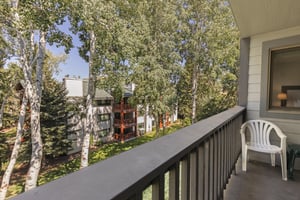 The private patio is surrounded by rustling aspens in the summer.