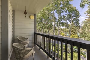 The private patio is surrounded by rustling aspens in the summer.