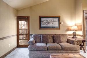 Sink into this plush sofa and feel the days stress melt away in your cozy mountain retreat.