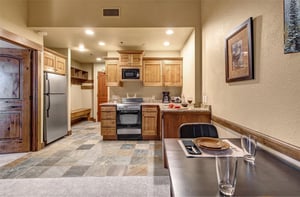 Step into your mountaininspired kitchen where rustic wood cabinets meet modern convenience.