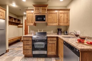 Your fullyequipped kitchen awaits with wood cabinets, granite countertops, and everything you need to create meals.