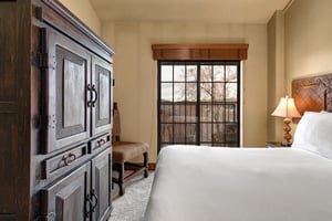 Settle into your cozy retreat with warm wood furnishings and crisp linens.