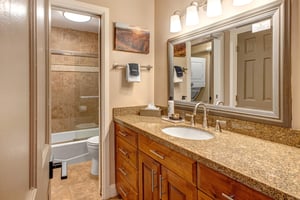 Resort Plaza 5024s shared bathroom with a bathtub and shower combination.