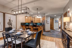 Your beautifully appointed openconcept living space features a modern kitchen with granite countertops, elegant dining area, and mountaininspired décor perfect for memorable meals together.