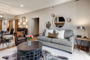 Relax in your stylish living space with plush seating, modern décor, and an open layout perfect for unwinding after exploring the area.