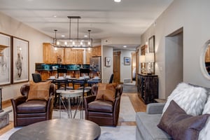 Relax in your spacious openconcept living area featuring plush leather seating, elegant dining space, and fullyequipped kitchen with modern finishes.