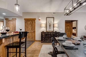 Gather around your elegant dining table for memorable meals, with the open kitchen bar creating a perfect space for conversation and entertaining.