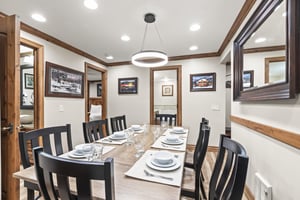 Your elegant dining space features mountainthemed art and seating for eight, perfect for memorable meals together.