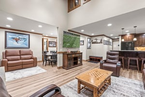 Relax in your spacious living room with leather seating and watch the game on the wall mounted TV.