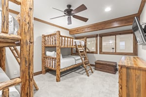 Youll love this rustic bunk room with handcrafted log furniture and mountain charm.