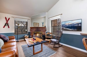Cozy up in your mountain retreat living room with crackling fireplace, and rocking chair.