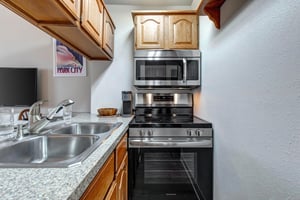 The small but wellequipped kitchen.