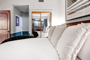 Sink into plush white linens on a kingsize bed.