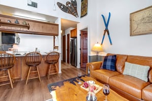 Unwind in your cozy living space with rich leather seating and rustic touches.