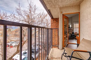 The private balcony with two chairs.