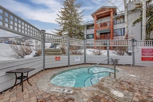 Snow Flower Condominiums offer an outdoor hot tub with mountain views.