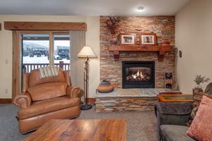 Cozy up by your crackling fireplace while watching snow fall through panoramic windows.