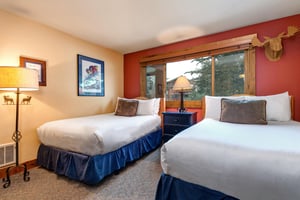 Relax in your cozy bedroom with two fullsize beds.