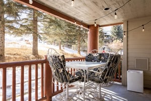 Snow Flower 6 has a private patio with a table and four chairs with comfortable cushions.