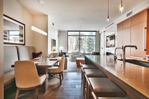Striking kitchen island and dining nook for seating for 10