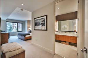 Main bedroom entrance, convenient upholstered wooden bench and ensuite bathroom