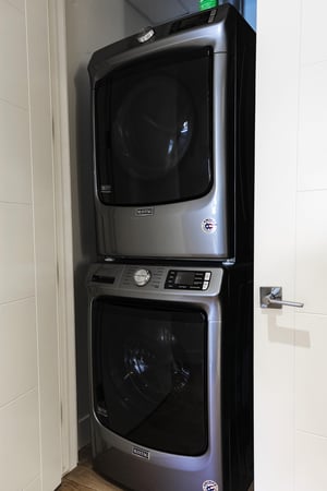 Maytag stackable washerdryer in the guest bedroom closet