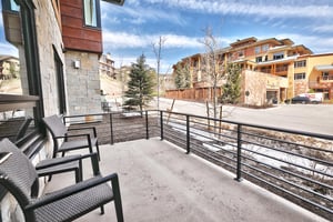 Relaxing chairs and side table on the private patio