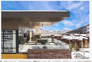Breathtaking penthouse patio in Canyons Village with snowy mountains in the background