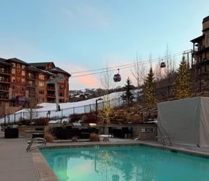The Lift Condominiums heated pool with the Sunrise Gondola, providing easy skiinskiout access.